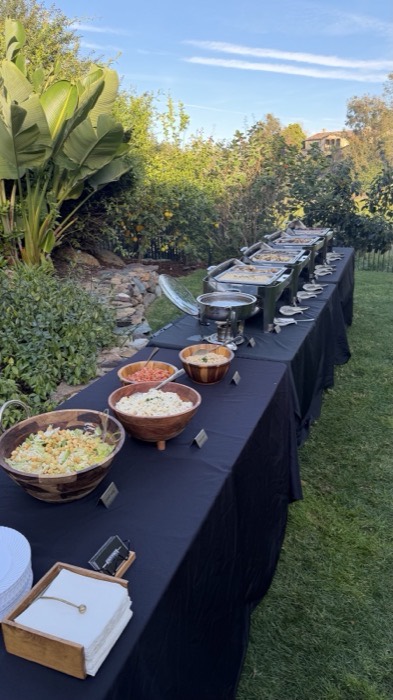 Catering buffet set up outdoors in a garden